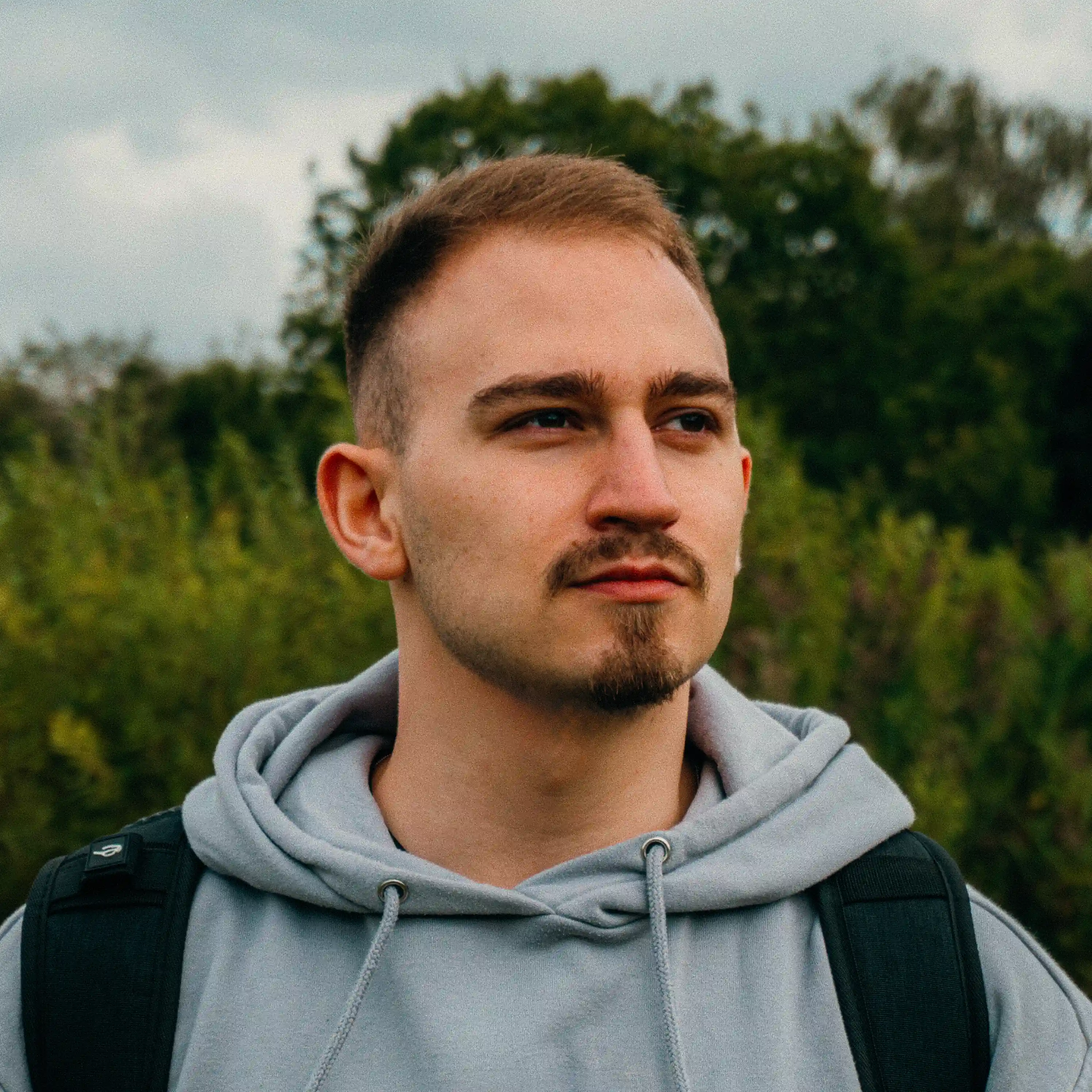 Profile picture of me facing to the side, with a nice background in the nature.